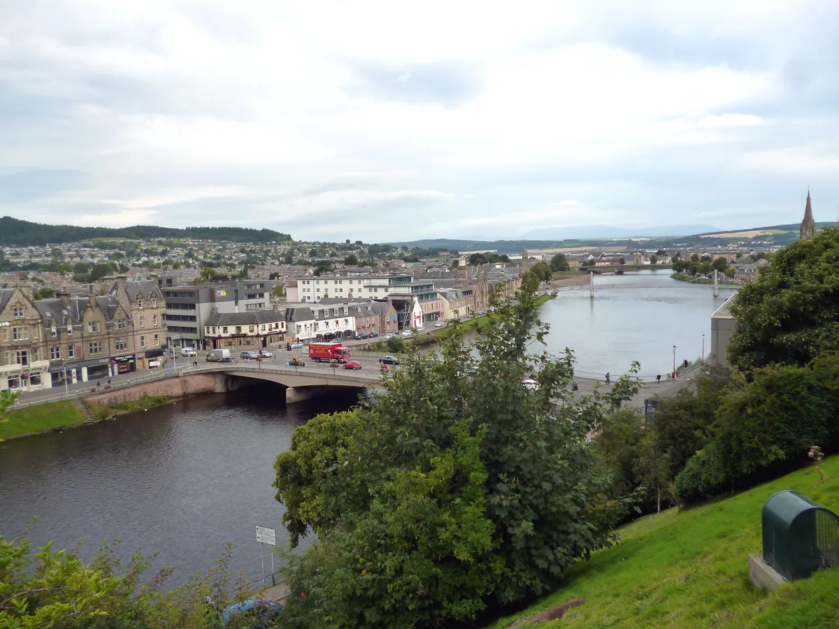 Wide view of the River Ness flowing through Inverness, Scotland, past Ness Bridge.