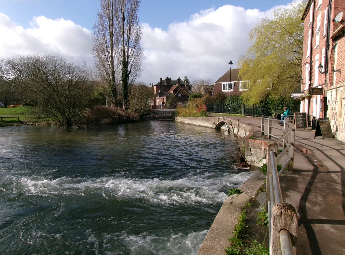 River Avon flowing past a weir near the Old Mill in Salisbury, Wiltshire