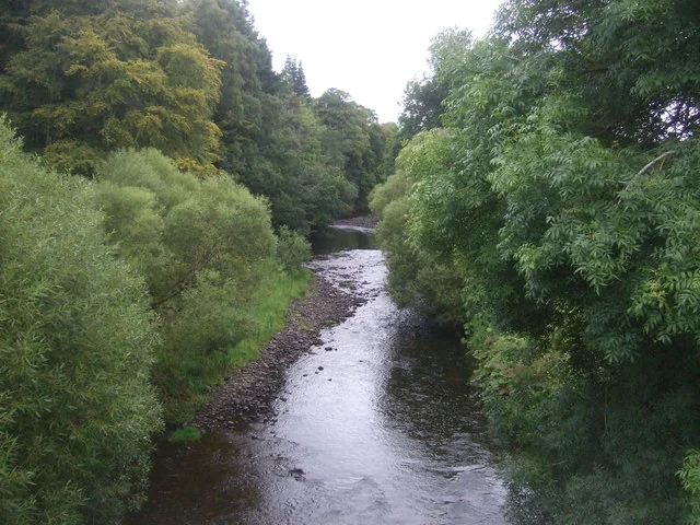 The Leader Water flowing between wooded banks near Earlston, Scottish Borders