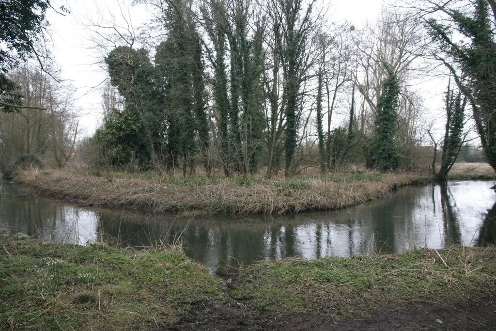 View of a horseshoe bend on the River Pang chalk stream near Pangbourne, Berkshire, England.