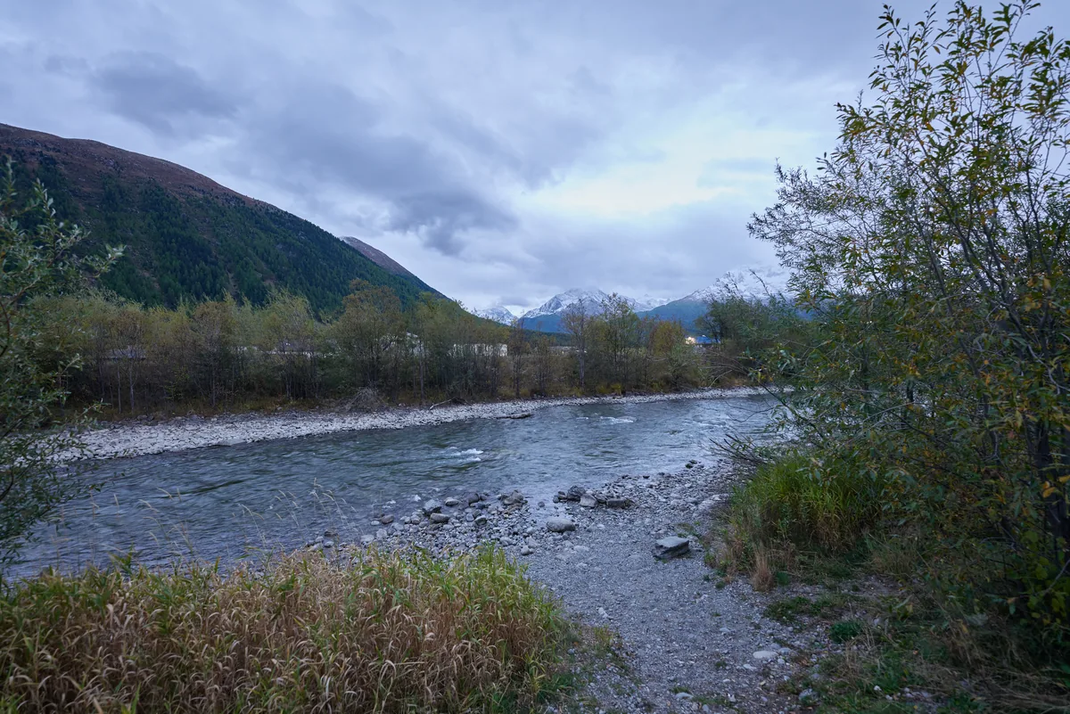 Gravel-bar reach of the Inn river with Alpine peaks in the background, Engadin