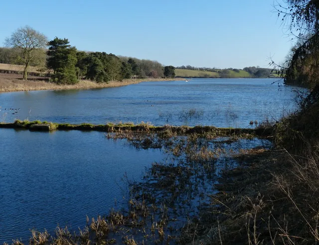 Calm water of Thornton Reservoir in Leicestershire, seen from its western arm