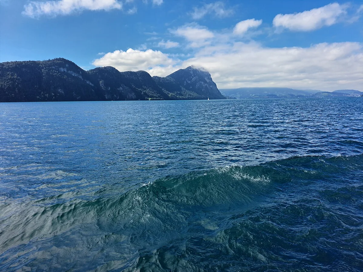 Open water on Lake Lucerne with the surrounding Alpine peaks