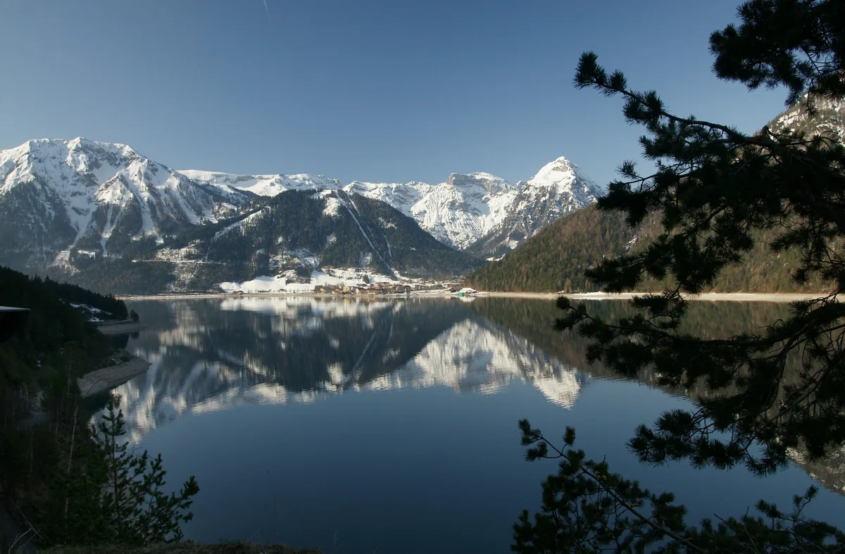 View across Achensee lake toward the snow-capped Karwendel mountains near Pertisau, Austria
