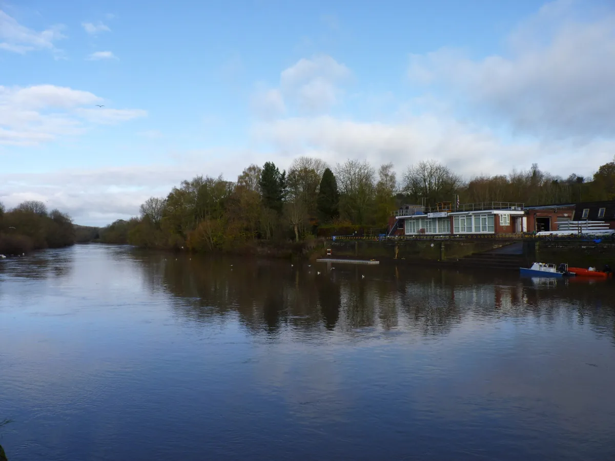 A wide, calm rural stretch of the River Severn upstream of Bewdley, Worcestershire, bordered by trees and open countryside.
