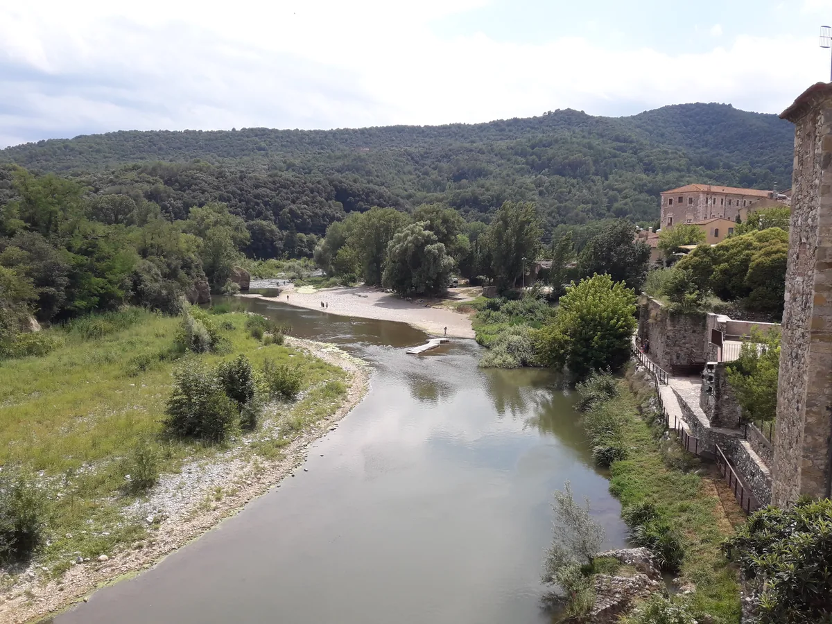 The Fluvia river flowing past the historic town of Besalu, Catalonia