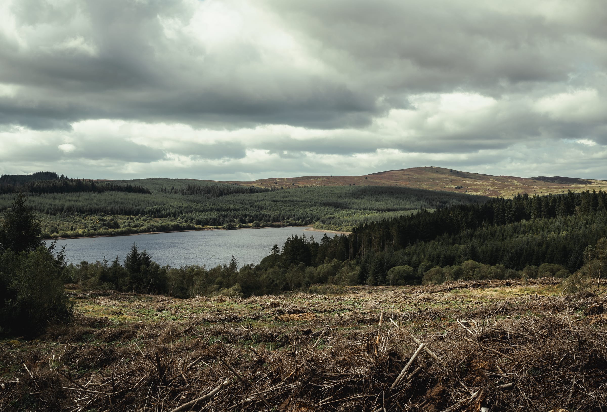 Wide landscape view of Alwen Reservoir, North Wales, the open water set among upland moorland and hills.
