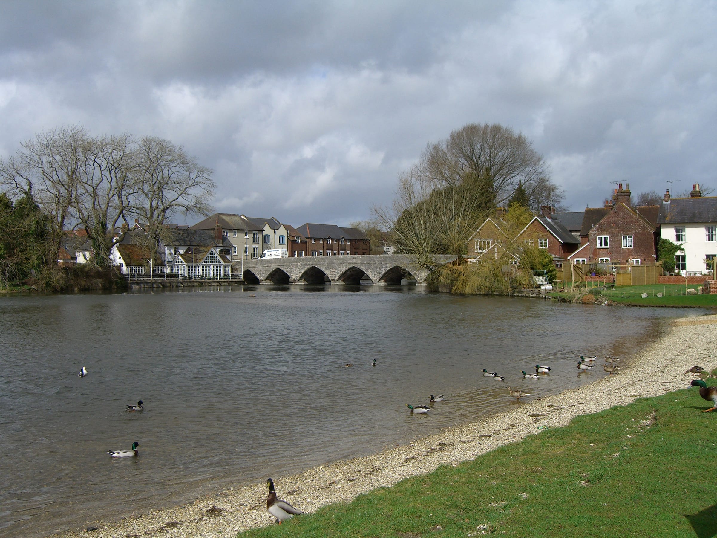 The medieval seven-arch stone bridge over the Hampshire Avon at Fordingbridge with the river beneath.