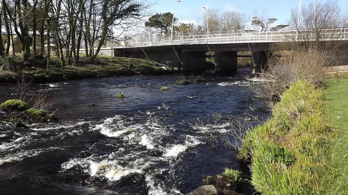 The Bunowen River flowing under a stone bridge near Louisburgh, County Mayo, Ireland.