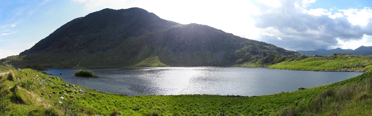 Panoramic view of Barfinnihy Lake with Boughil Mountain rising behind it in County Kerry, Ireland