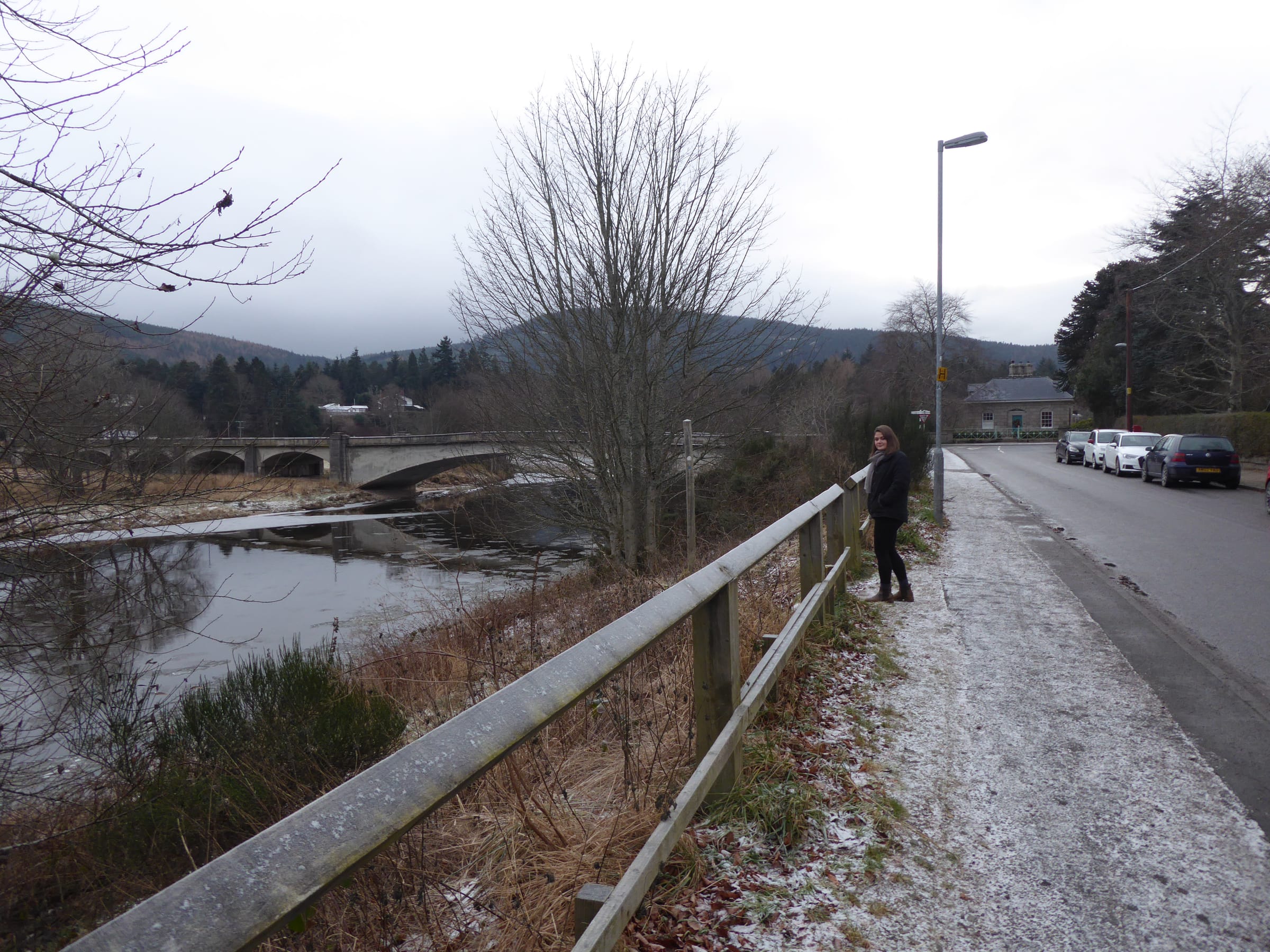 The River Dee flowing through open valley near Aboyne, Aberdeenshire, with wooded banks and a broad pebbly channel.