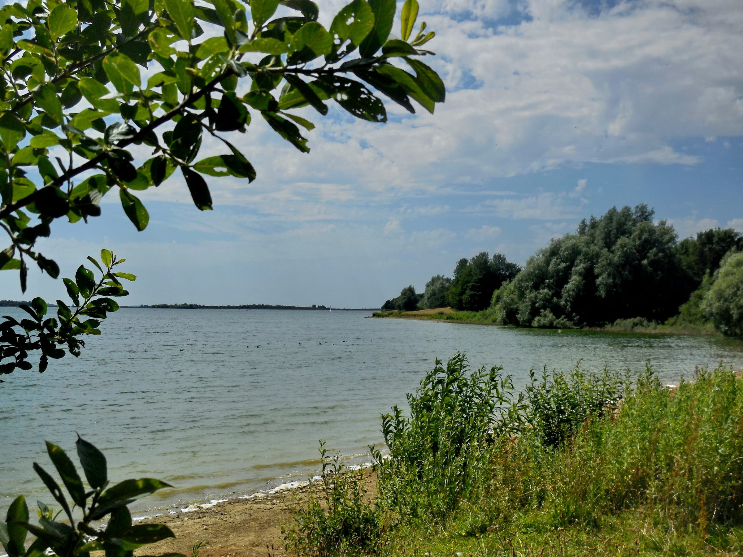 Landscape photograph of Draycote Water reservoir showing open water and surrounding countryside.