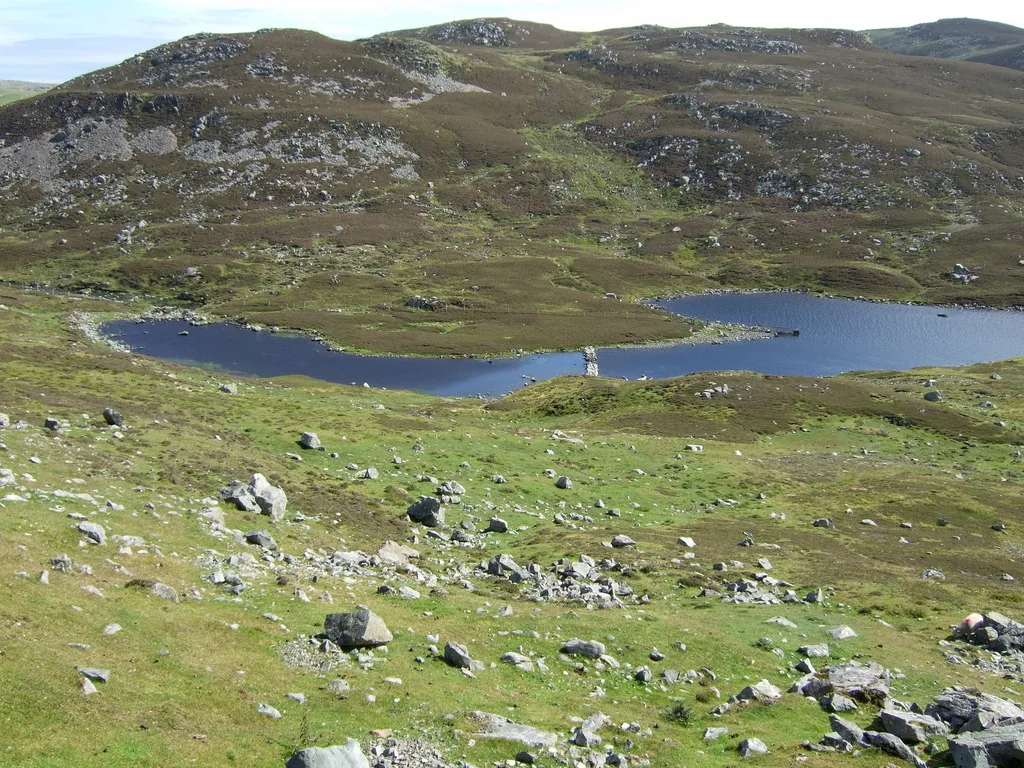 View across Sulma Water, a small freshwater loch on the West Mainland of Shetland, surrounded by rolling moorland.