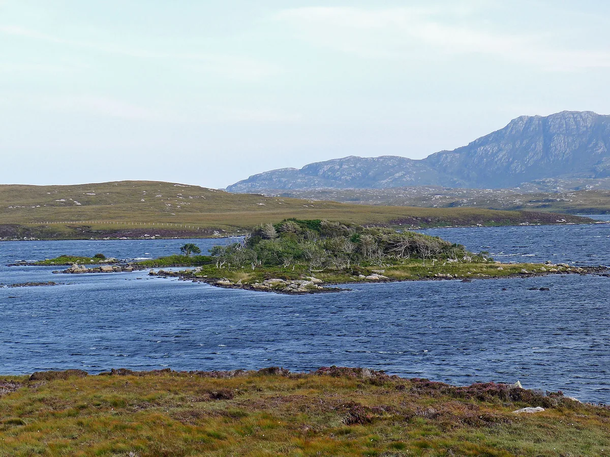 Loch Druidibeg, a machair loch on South Uist, with the hill of Hecla in the distance