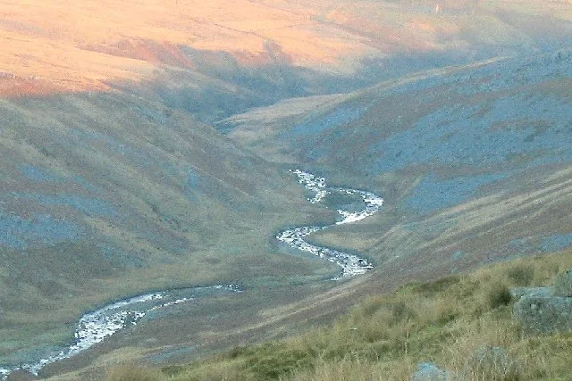 The Afon Twrch, a small upland river, winding through a moorland valley in the Brecon Beacons