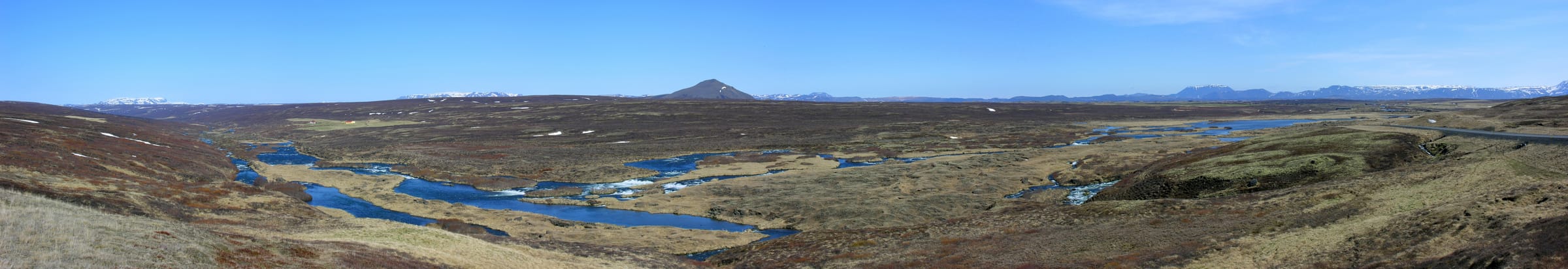 Panoramic view of the Laxárdalur valley with the Laxá í Aðaldal running through a wide green valley.