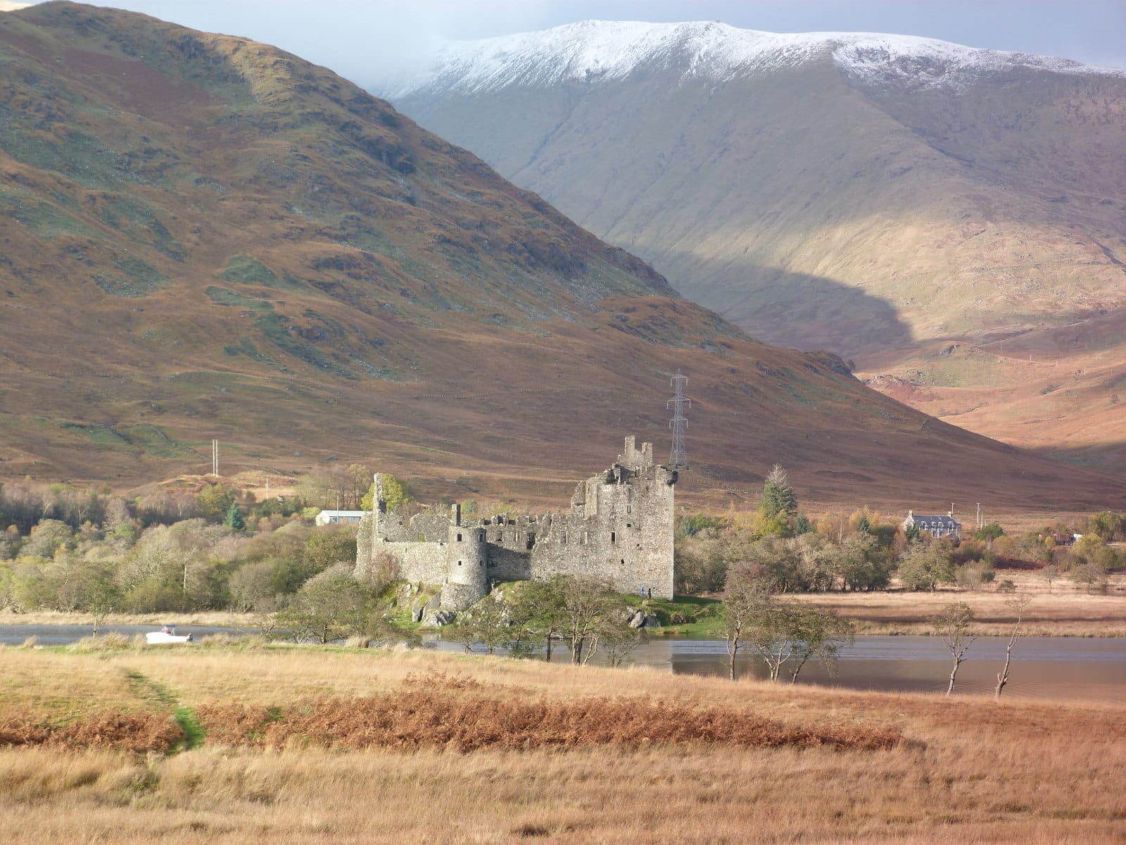 Kilchurn Castle standing at the head of Loch Awe with open water in the foreground, Argyll.