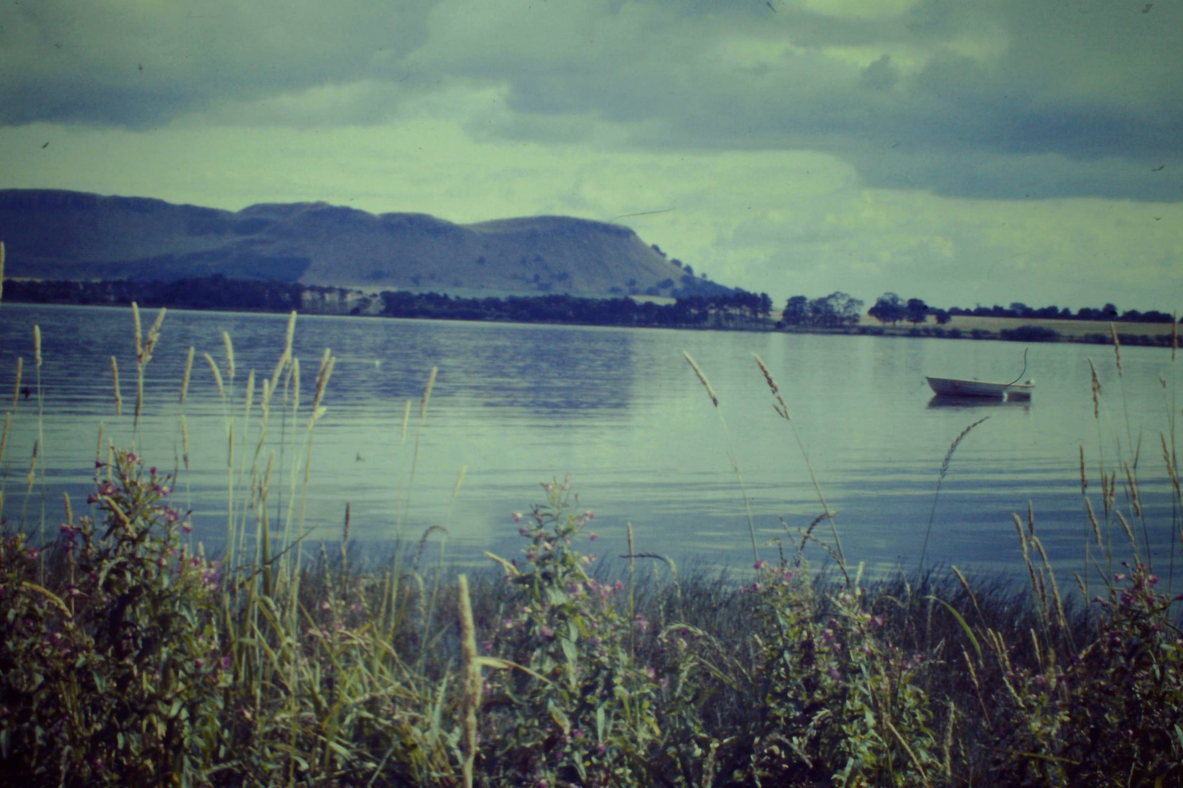 Open water of Loch Leven at Kinross on a clear day, with the Lomond Hills visible on the far shore.