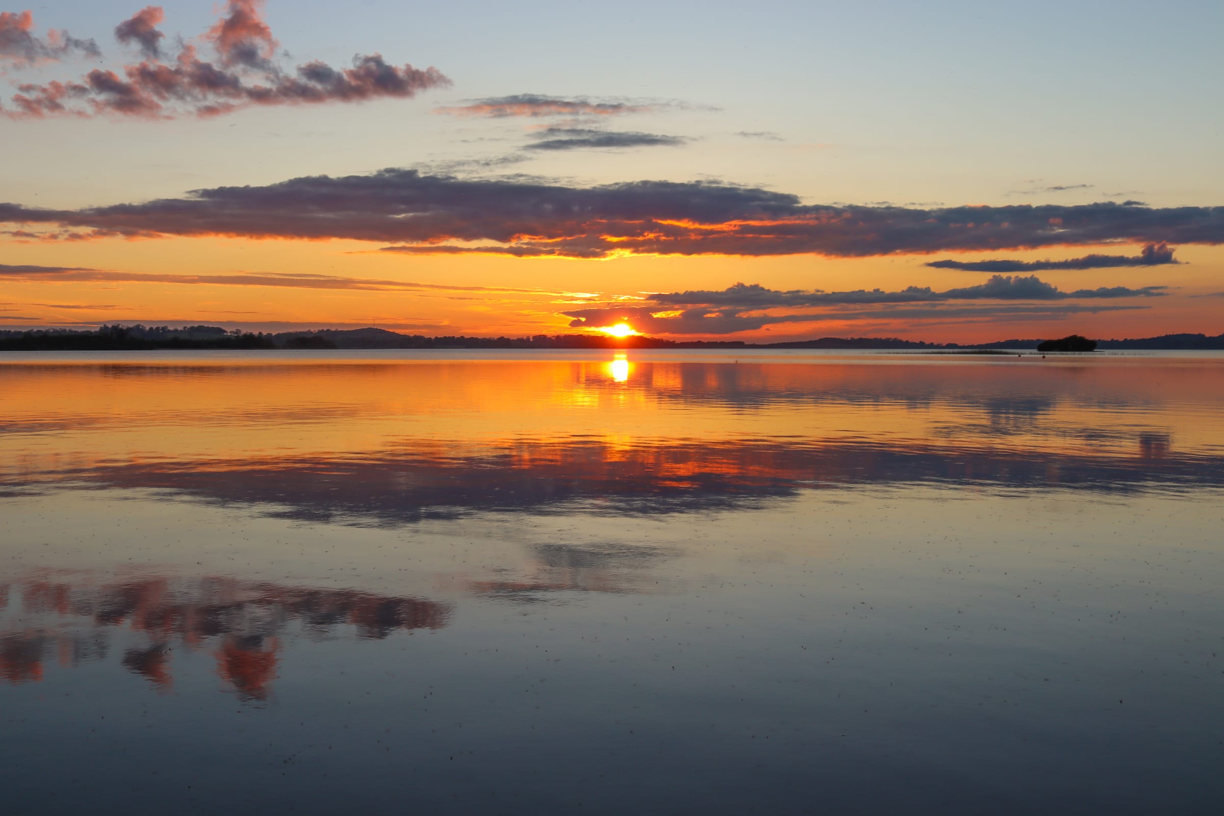 Golden sunset over the open water of Lough Owel, County Westmeath.