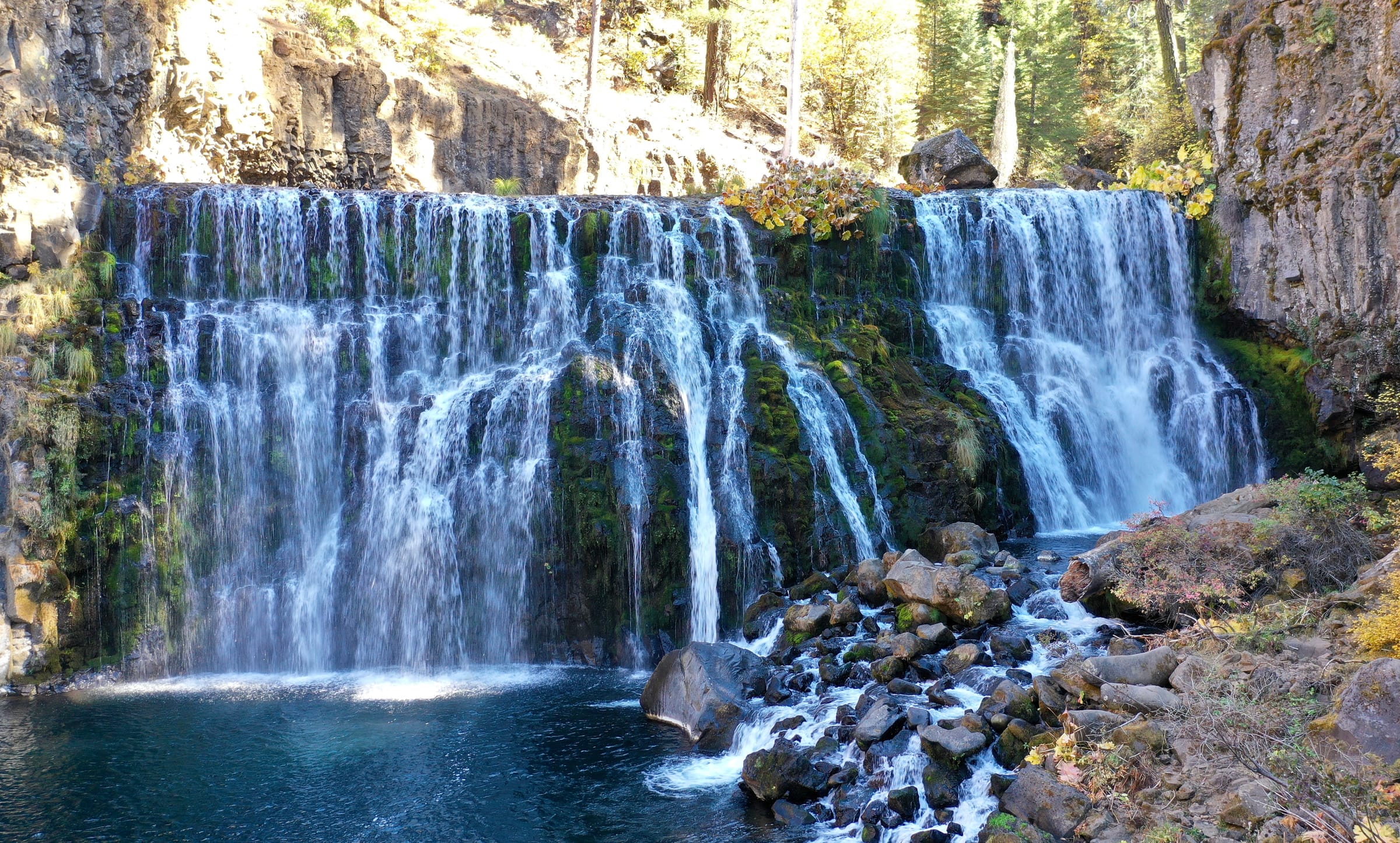Middle Falls on the McCloud River cascading over volcanic rock into a deep pool, Shasta County, California.