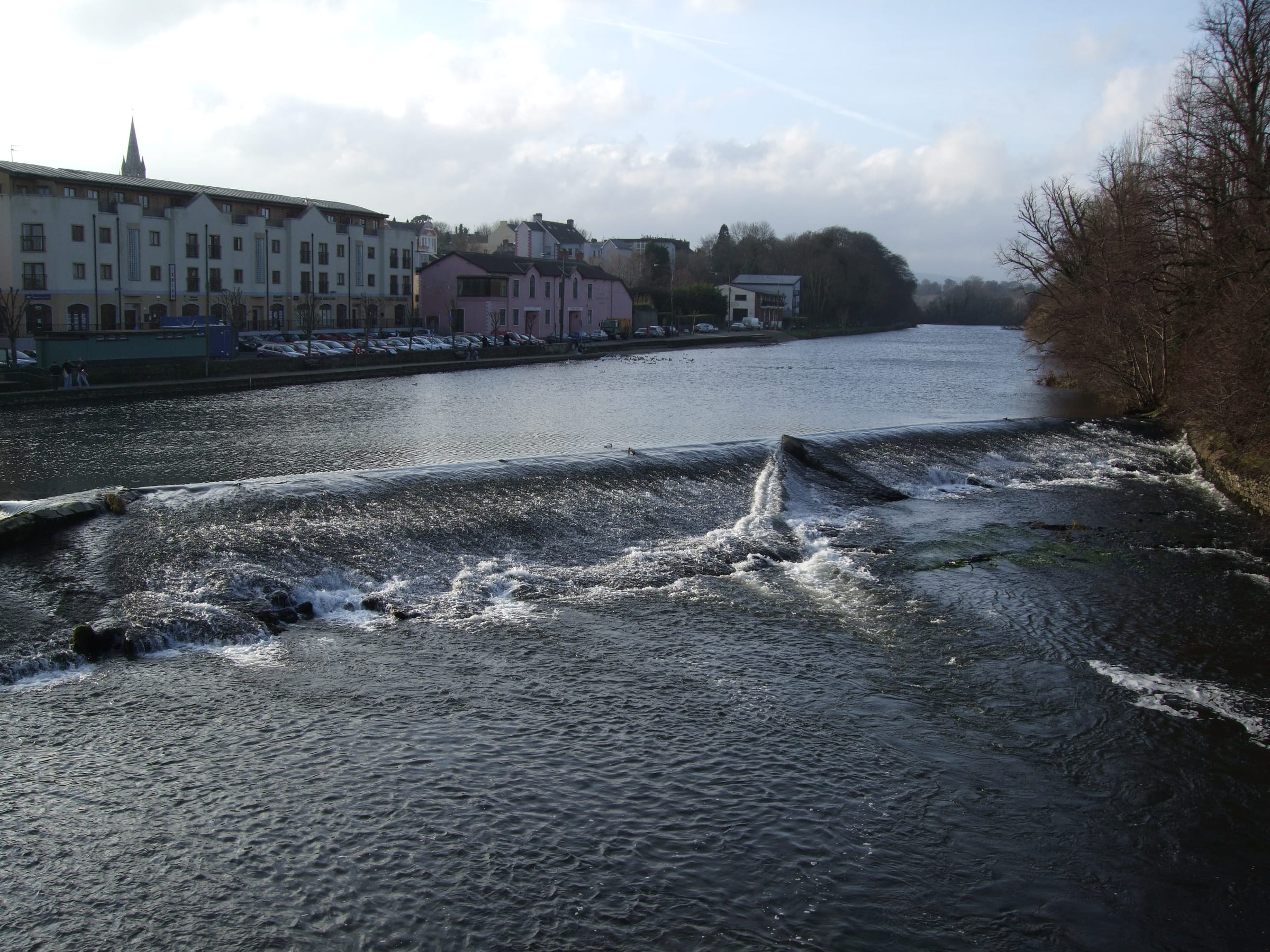 The weir on the Munster Blackwater at Fermoy, County Cork, fast water over the sill.