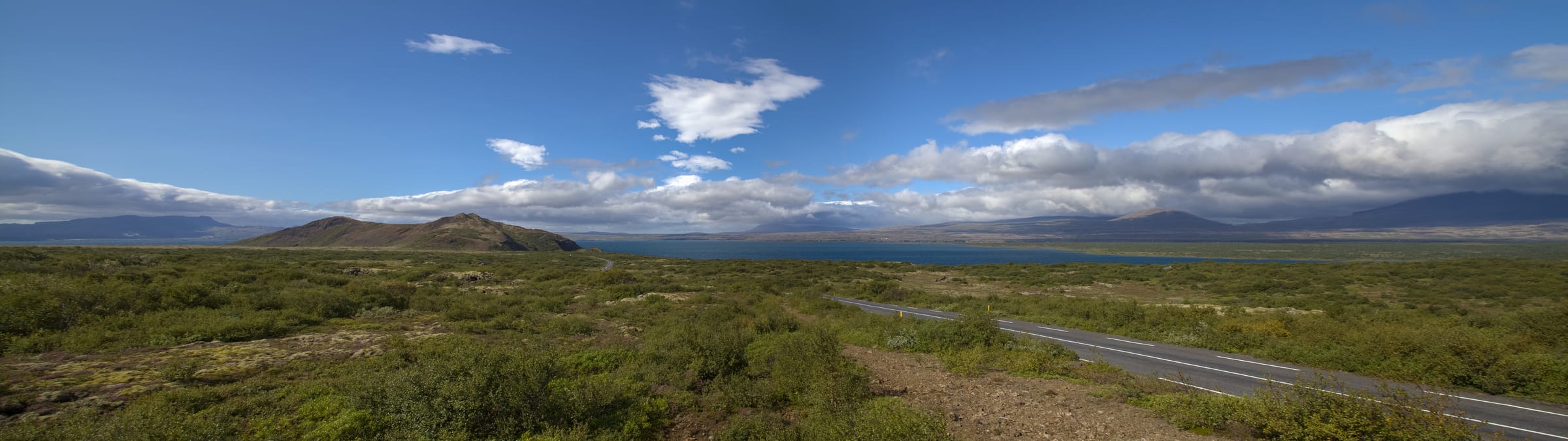 Panoramic view of Þingvallavatn from the Hakið outlook, Þingvellir National Park, broad open water.