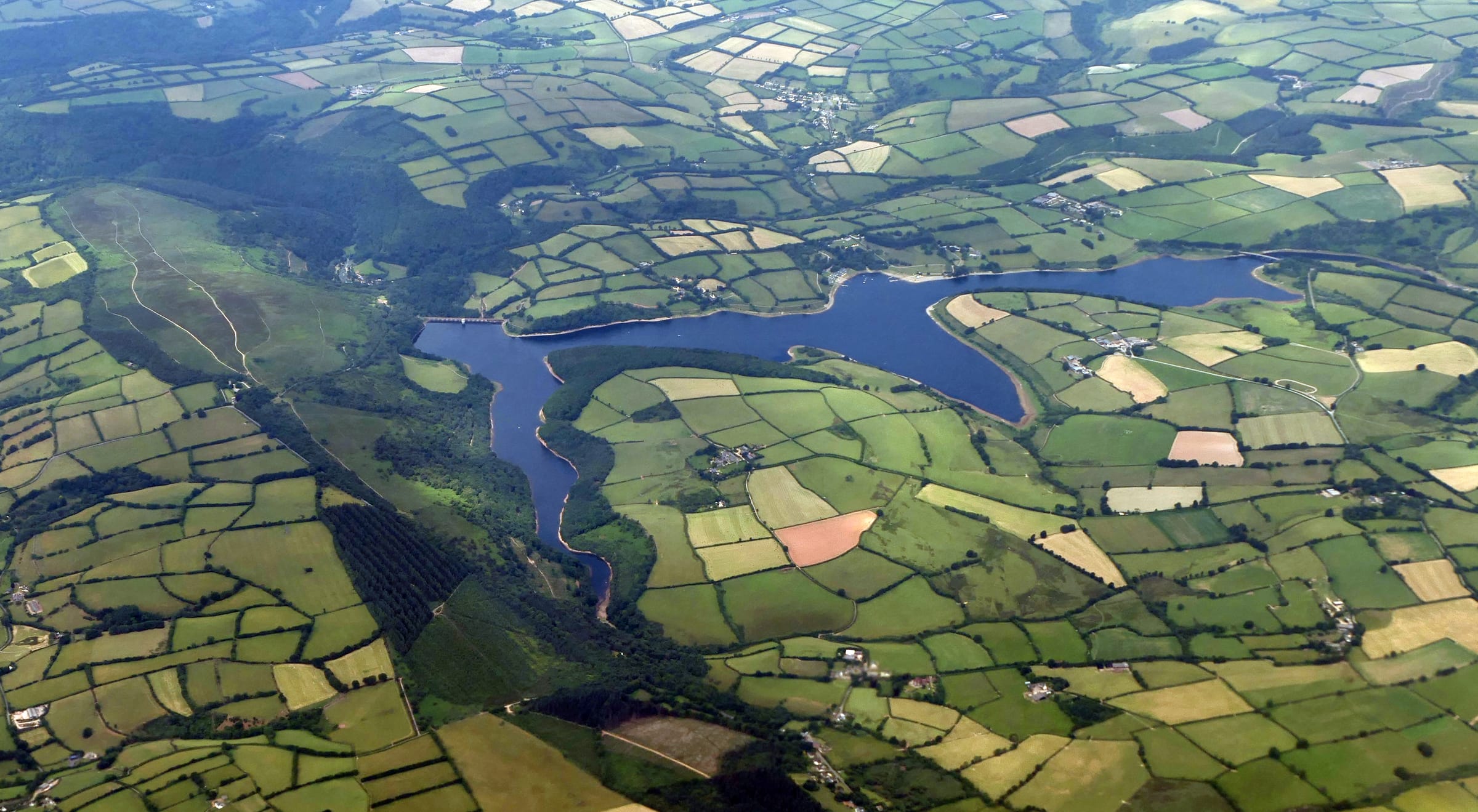 Aerial view looking down on Wimbleball Lake and Haddon Hill in Somerset, the full extent of the reservoir.