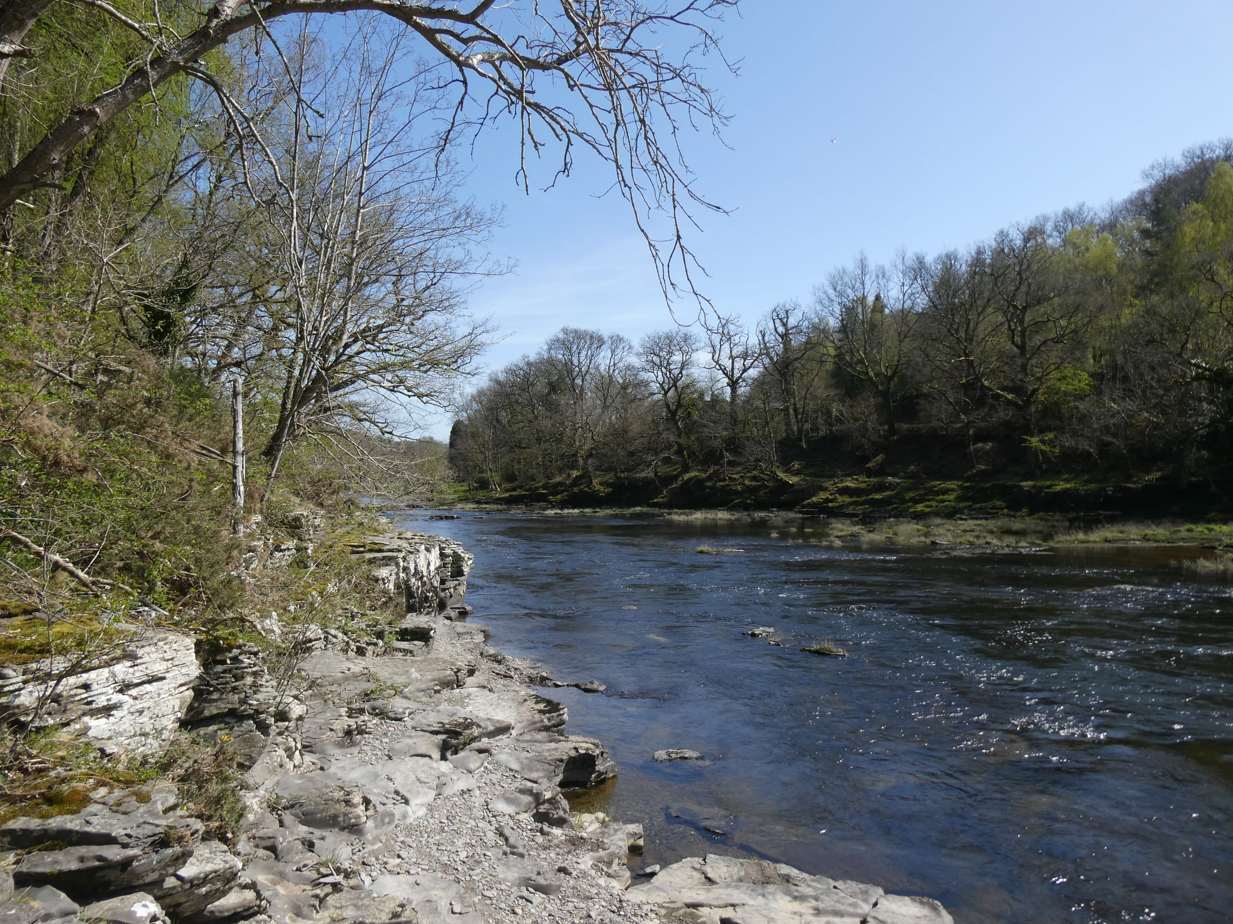 The River Wye near Erwood, the river channel against a backdrop of Welsh upland pasture and hillside.